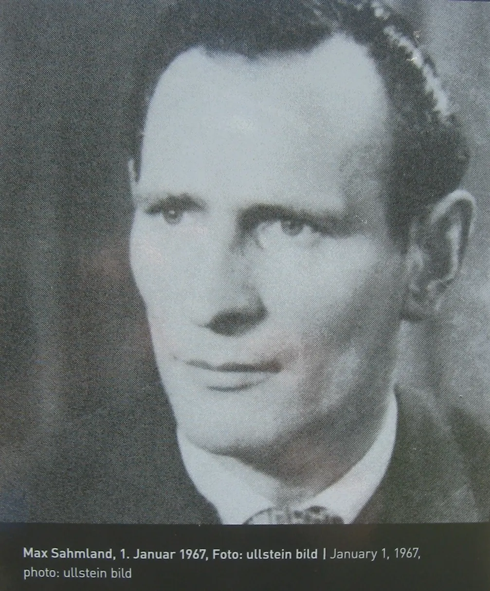 Black-and-white portrait of a man with short dark hair, wearing a jacket and patterned tie, with the caption "Max Sahmland, 1. Januar 1967, Foto: ullstein bild"