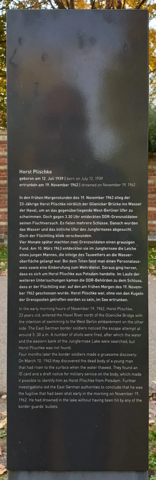Dark panel with a German and English text headed 'Horst Plischke', born 12 July 1939, drowned 19 November 1962