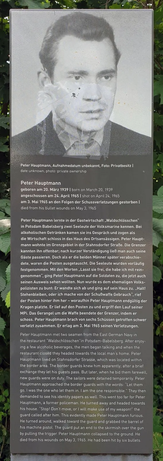Dark panel with a black-and-white portrait of a man above a German and English text headed 'Peter Hauptmann'